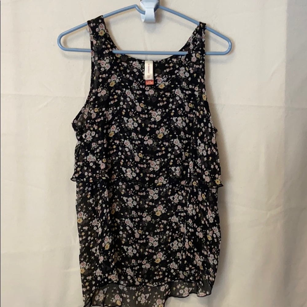 Flowered no sleeve blouse.